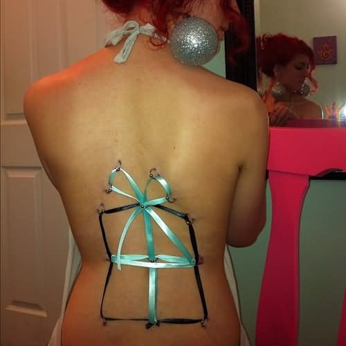 Ribbon And Corset Back Body Piercing