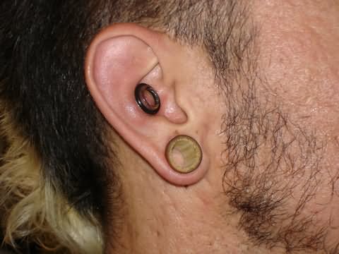 Right Ear Lobe And Dermal Punch Piercing