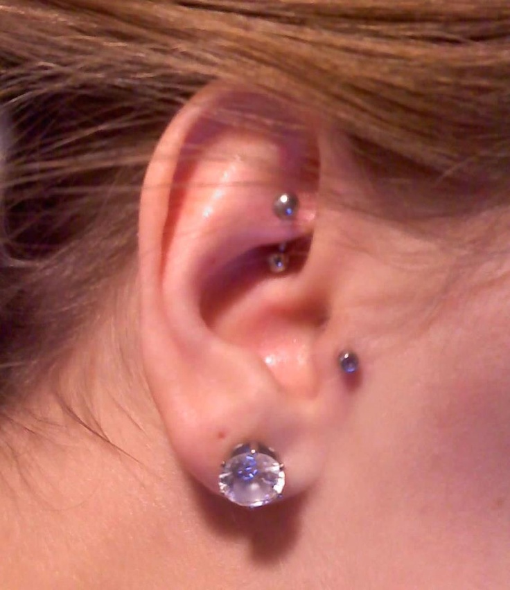 Right Ear Lobe Piercing With Tragus Piercing And Rook Piercing