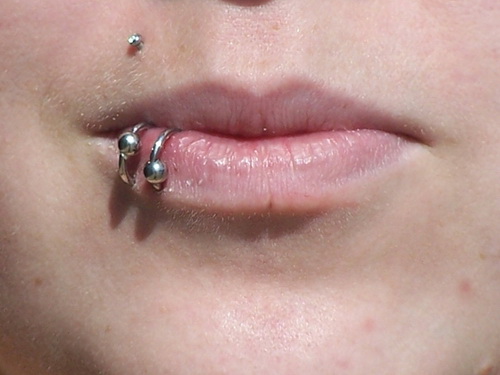 Right Monroe And Silver Bead Rings Lower Lip Piercing