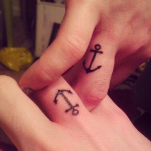 Simple Black Anchor Tattoo On Couple Finger