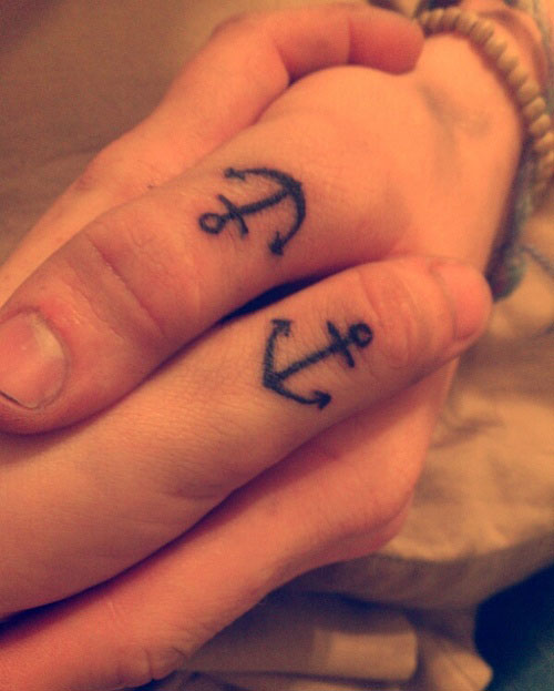Simple Black Anchor Tattoo On Couple Thumb