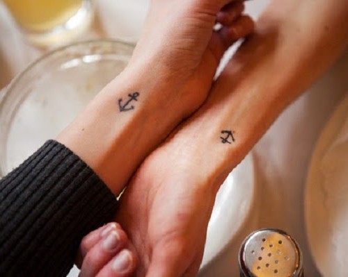 Simple Black Anchor Tattoo On Couple Wrist