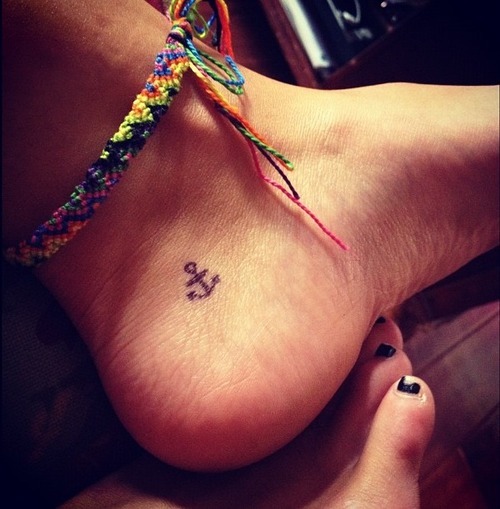 Simple Black Anchor Tattoo On Girl Ankle