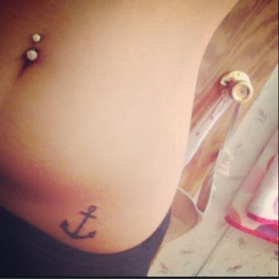 Simple Black Anchor Tattoo On Girl Left Hip