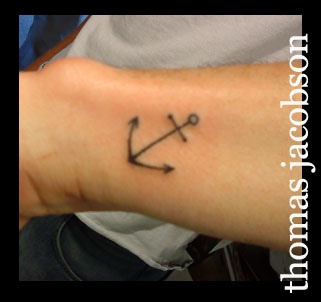 Simple Black Anchor Tattoo On Left Side Wrist