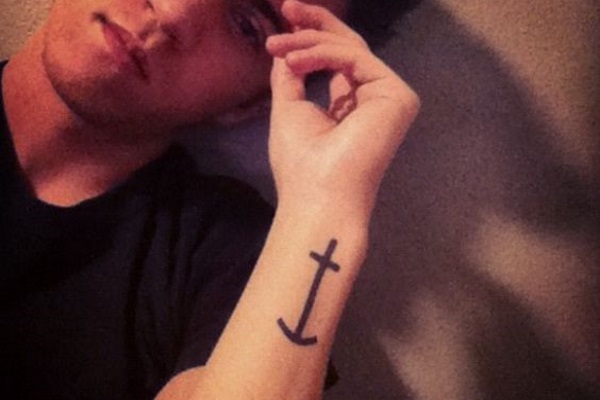 Simple Black Anchor Tattoo On Man Left Side Wrist