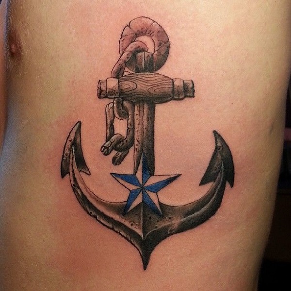 Simple Black Ink Anchor With Nautical Star Tattoo On Man Left Side Rib