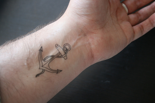 Simple Black Outline Anchor Tattoo On Left Wrist