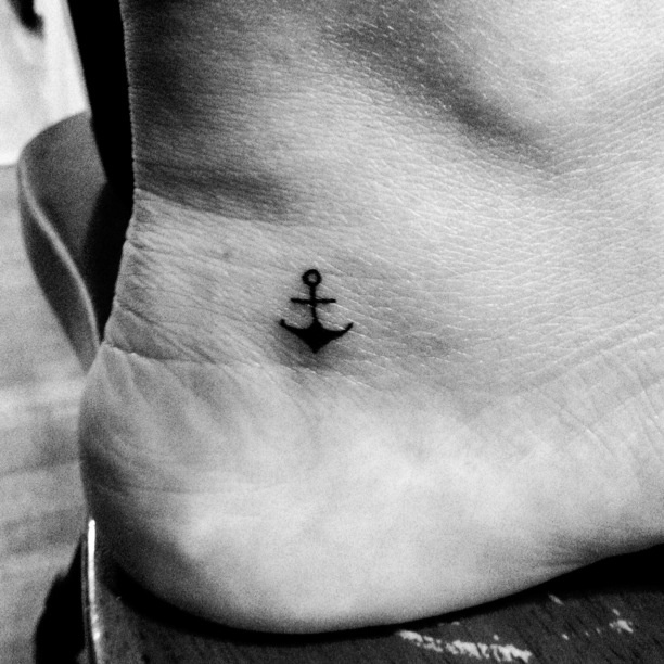 Simple Black Small Anchor Tattoo On Right Ankle