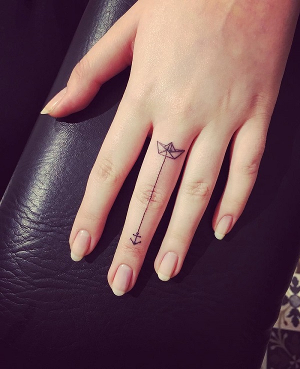 Simple Paper Boat With Anchor Tattoo On Girl Left Finger