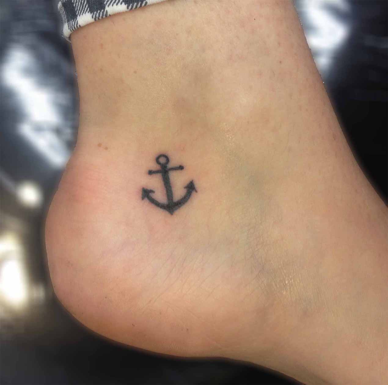 Small Black Anchor Tattoo On Left Heel