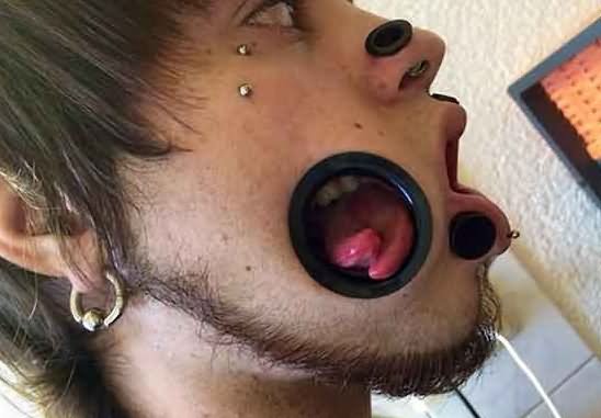 Stretched Nose And Cheek Body Piercing