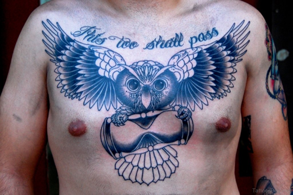 This Too Shall Pass - Black Ink Flying Owl With Hourglass Tattoo On Man Chest