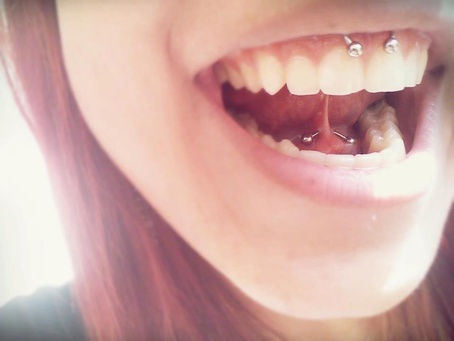 Tongue Frenulum And Smiley Piercing With Circular Barbell