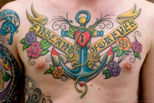 Traditional Anchor With Flowers And Banner Tattoo On Chest