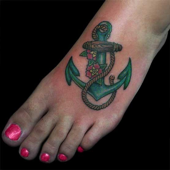 Traditional Anchor With Flowers Tattoo On Girl Left Foot