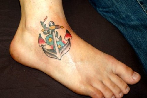 Traditional Anchor With Flowers Tattoo On Man Right Ankle