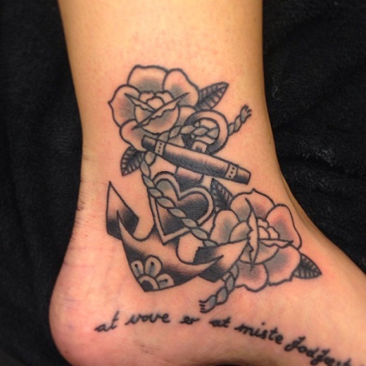 Traditional Black Ink Anchor With Flowers Tattoo On Right Ankle