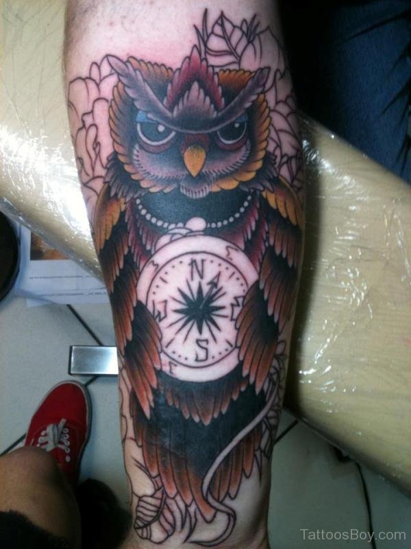 Traditional Owl With Compass Tattoo On Forearm