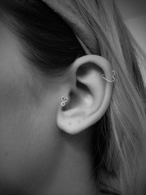 Tragus And Cartilage Piercing With Heart Ring