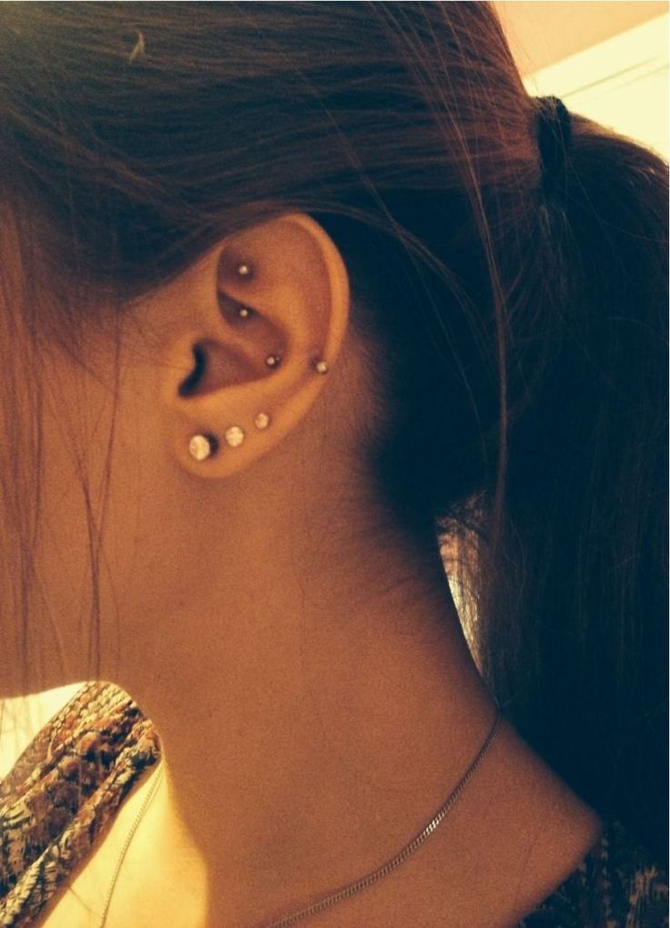Triple Ear Lobes And Snug And Rook Piercing