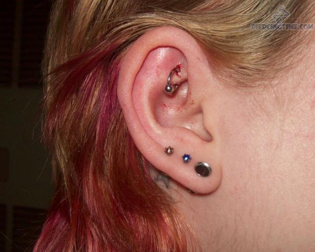 Triple Lobes And Rook Piercing With Silver Bead Ring