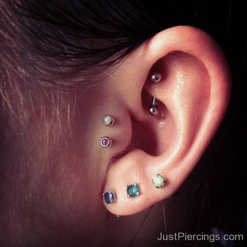 Triple Lobes And Tragus With Rook Piercing