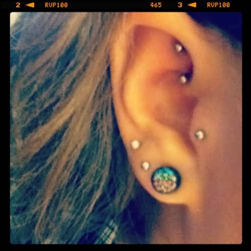 Triple Lobes, Tragus And Rook Piercing