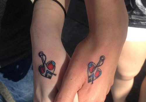 Unique Heart Anchor Tattoo On Couple Hand