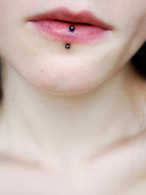 Vertical Lip Piercing With Black Barbell
