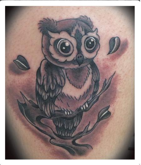 Wonderful Black Ink Owl On Branch Tattoo Design