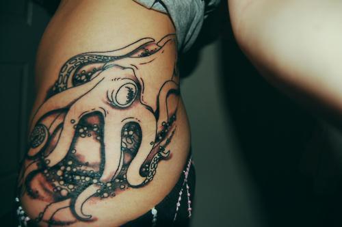 Amazing Black Ink Octopus Tattoo On Girl Left Hip