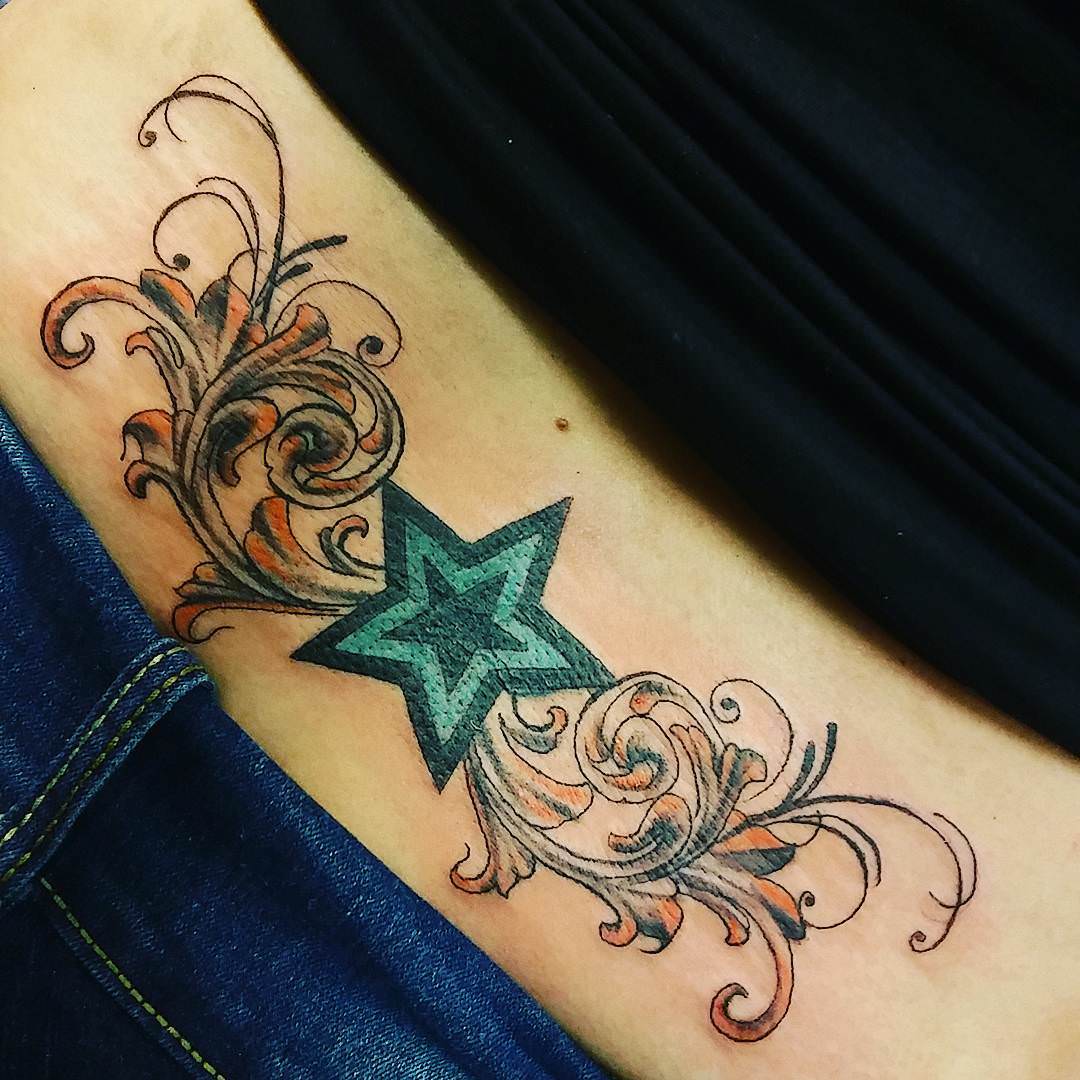 Amazing Star Tattoo On Girl Lower Back