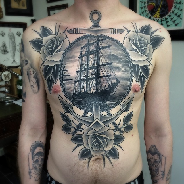 Attractive Black Ink Ghost Pirate Ship In Anchor Frame With Roses Tattoo On Man Full Body