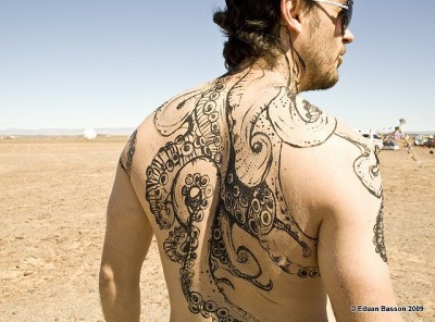 Attractive Black Ink Octopus Tattoo On Man Upper Back
