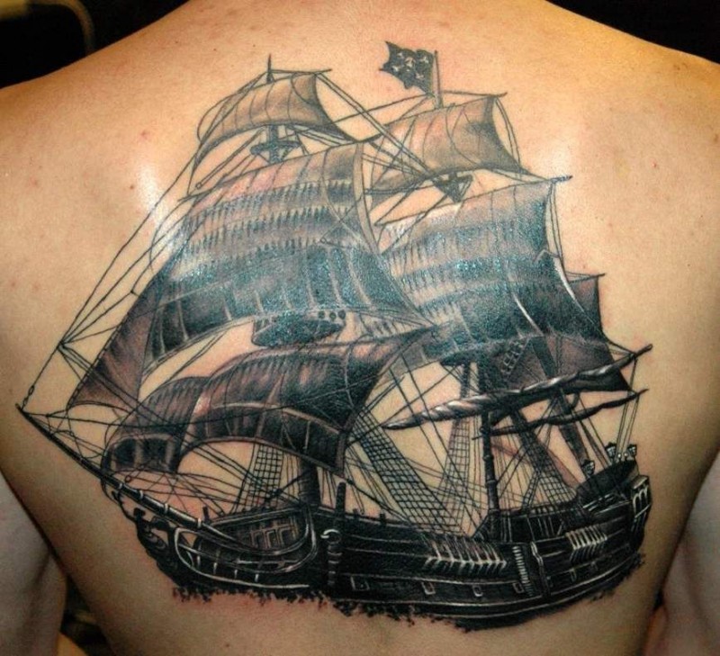 Attractive Black Ink Pirate Ship Tattoo On Upper Back