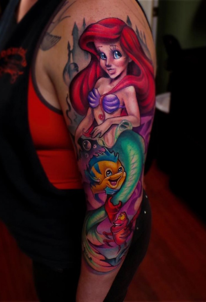 Attractive Little Mermaid With Fishes Tattoo On Left Half Sleeve