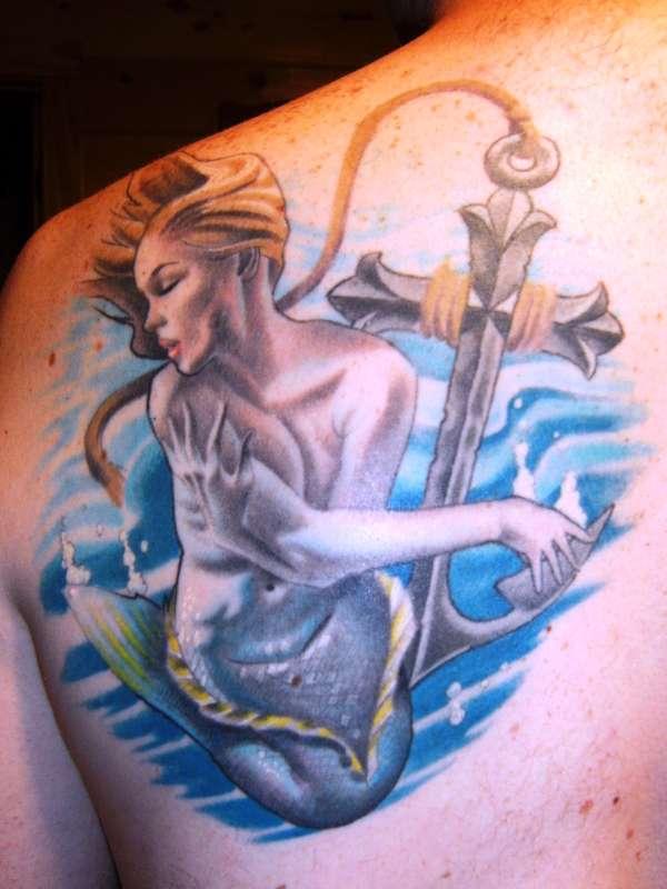 Attractive Mermaid With Anchor Tattoo On Left Back Shoulder