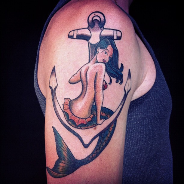 Attractive Mermaid With Anchor Tattoo On Right Shoulder