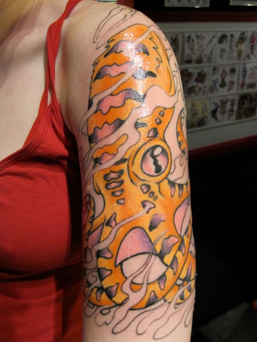 Attractive Octopus Tattoo On Women Left Half Sleeve