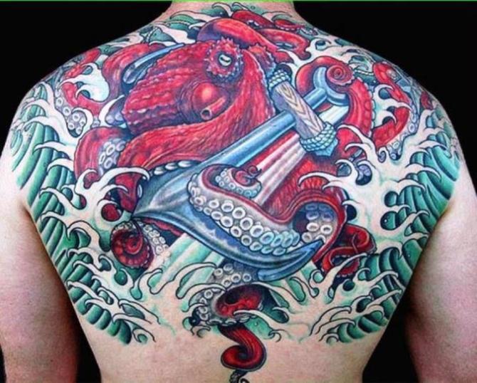 Attractive Octopus With Anchor Tattoo On Man Upper Back