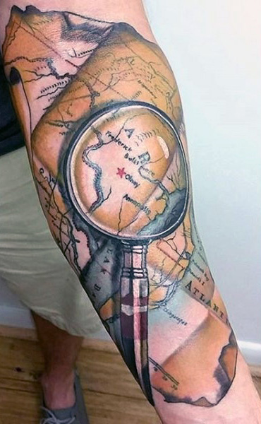 Attractive Pirate Map With Magnifier Glass Tattoo On Forearm