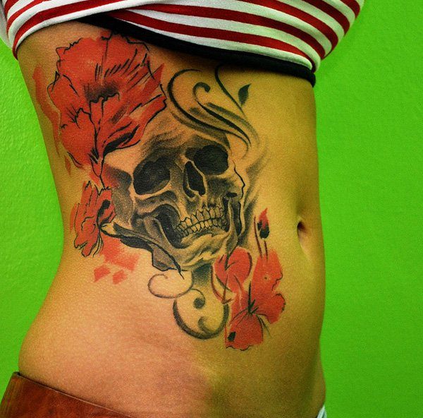 Attractive Pirate Skull With Flowers Tattoo On Right Side Rib