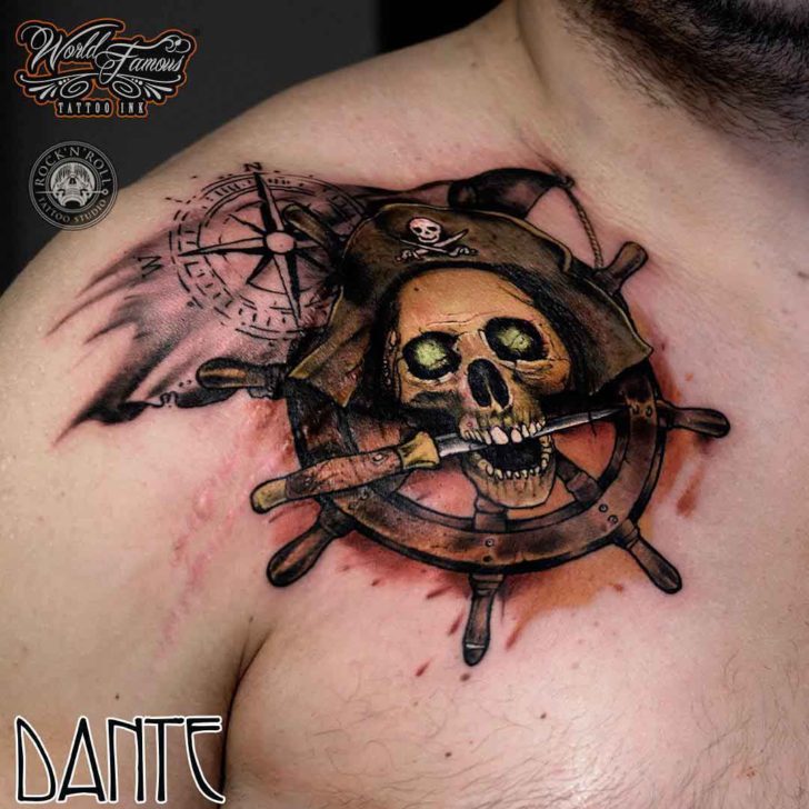 Attractive Pirate Skull With Ship Wheel Tattoo On Man Right Front Shoulder