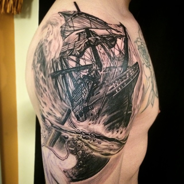 Awesome Black Ink Ghost Pirate Ship Tattoo On Right Shoulder