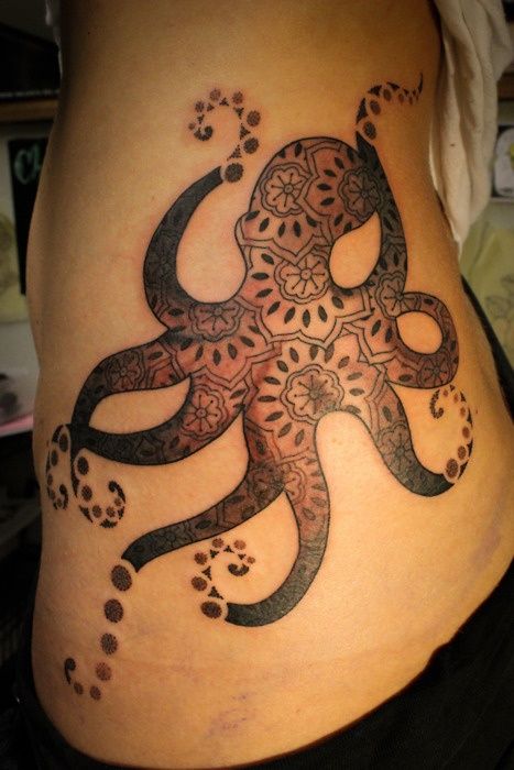 Awesome Black Ink Octopus Tattoo On Girl Left Hip