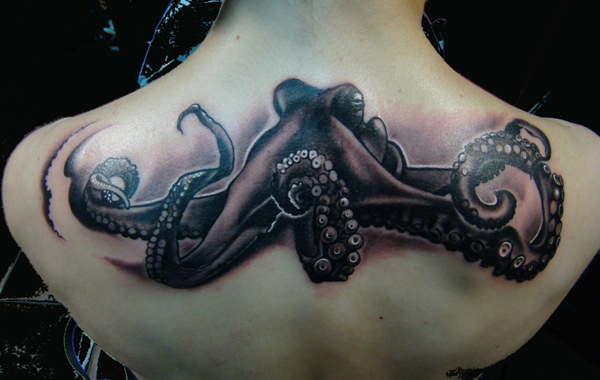 Awesome Black Ink Octopus Tattoo On Upper Back
