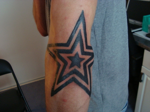Awesome Black Star Tattoos On Elbow