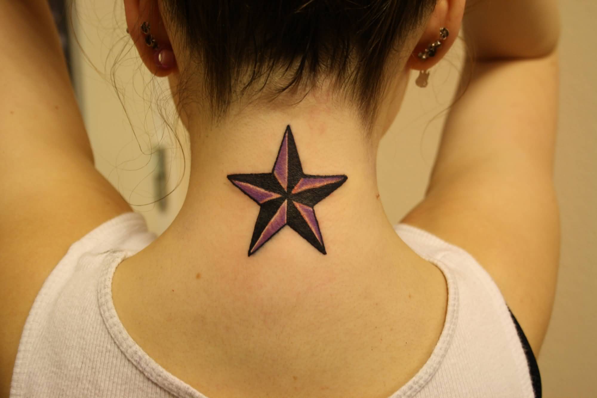 Awesome Nautical Star Tattoo On Girl Nape